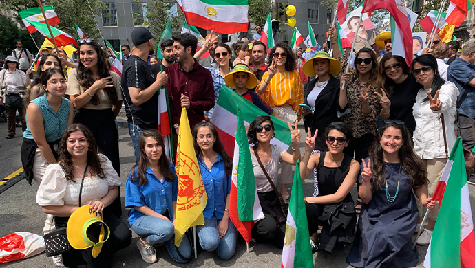 Supporters of MEK celebrate a Stockholm ruling against Hamid Noury