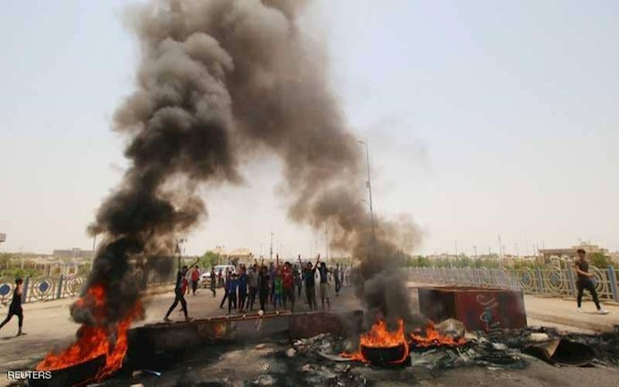 Demonstrators were also seen blocking a nearby main road by setting tires on fire 