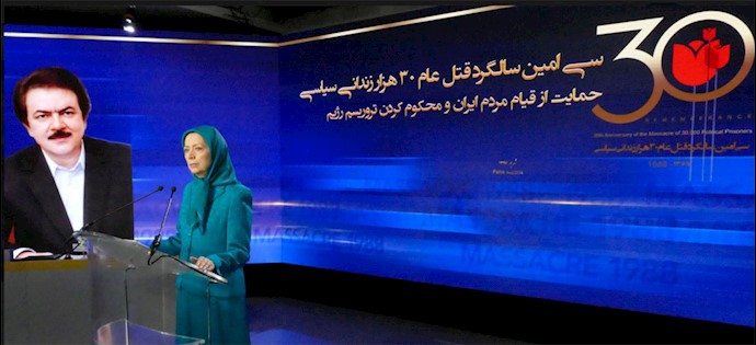 Maryam Rajavi and the picture of Masoud Rajavi the leader of the Iranian Resistance