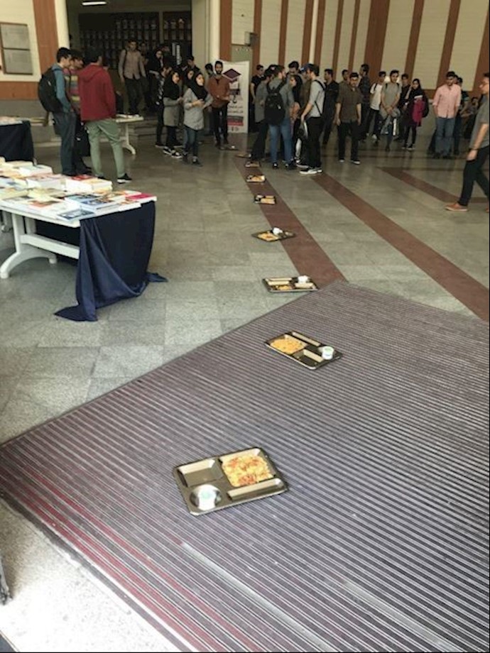 Khajeh-Nasir University students protest poor food quality by placing their food trays on the floor – Tehran, Iran – April 29, 2019