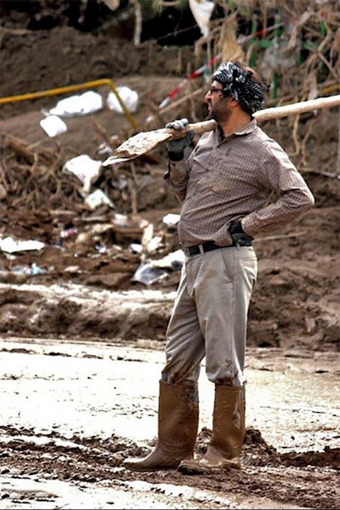 A man in Pol Dokhtar standing with the most primitive tool to fight one of the most horrible floods (Lorestan Province - Western Iran)