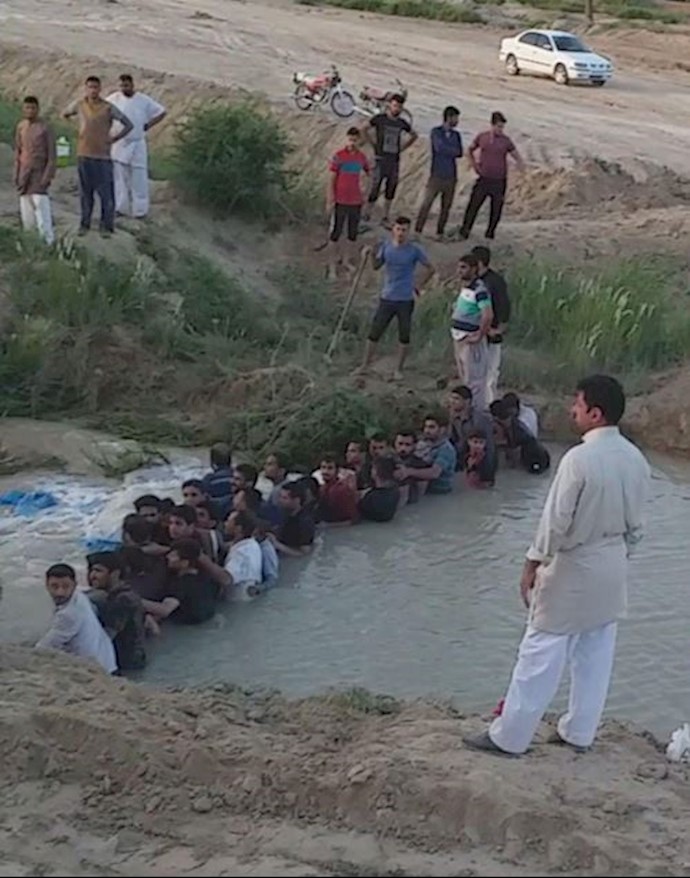 A village near the town of Shadegan, Khuzestan Province, are doing whatever they can to prevent floodwaters from destroying their lives